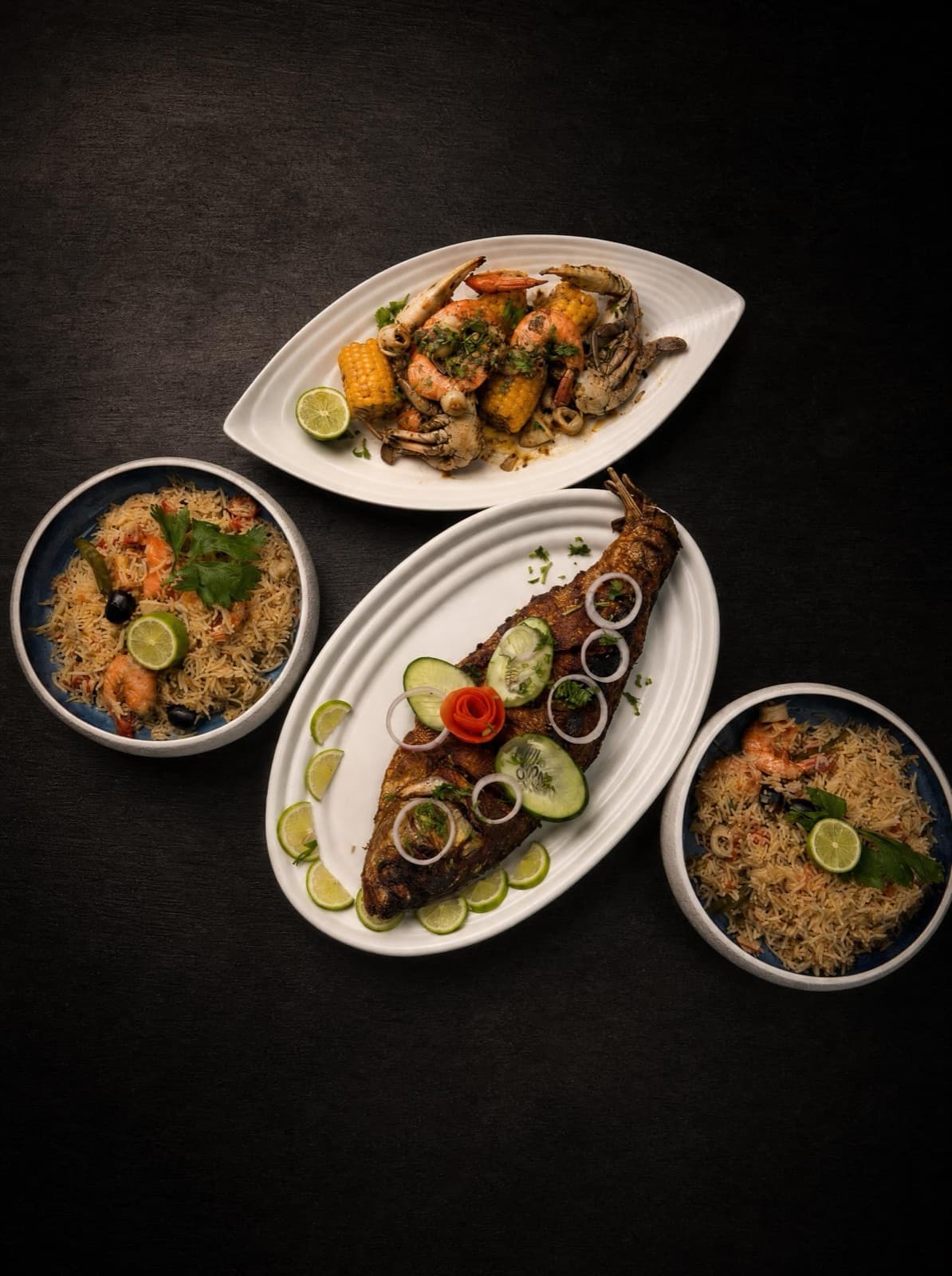 Seafood spread — grilled fish, crab, prawns and rice